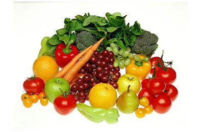 a pile of fruits and vegetables on a white background