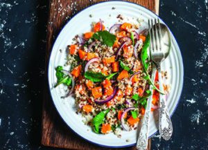 a white plate topped with rice and vegetables