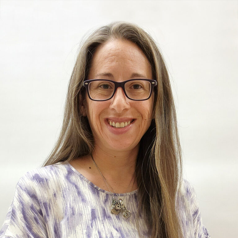 Brianne Fegarsky 1 a woman with glasses smiling for the camera